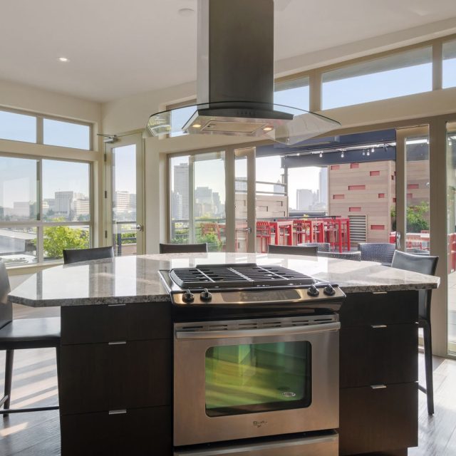 Collins on Pine Resident Lounge Kitchen Island Terrace View 01