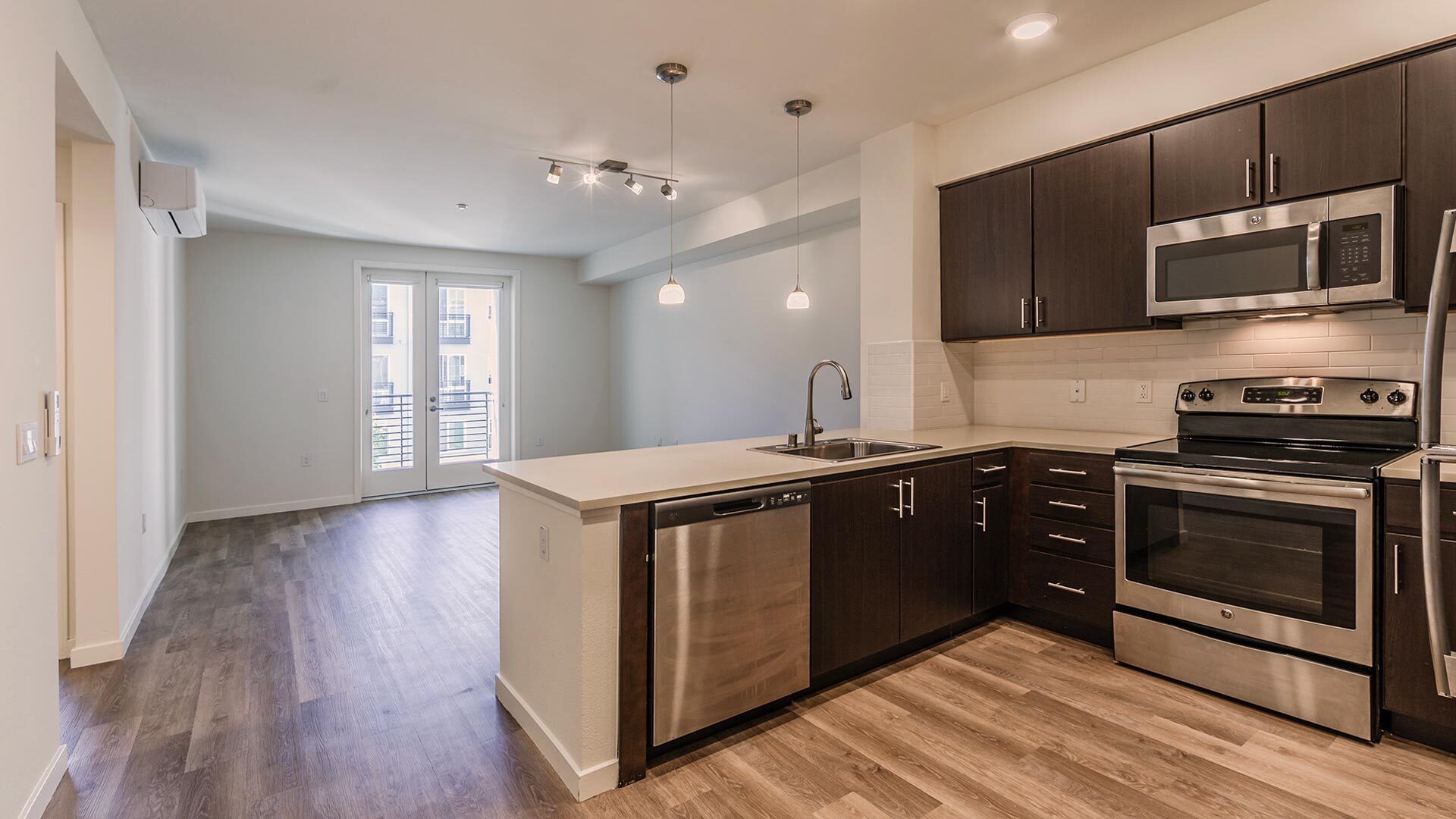 The lark cypress 1br kitchen livingroom view