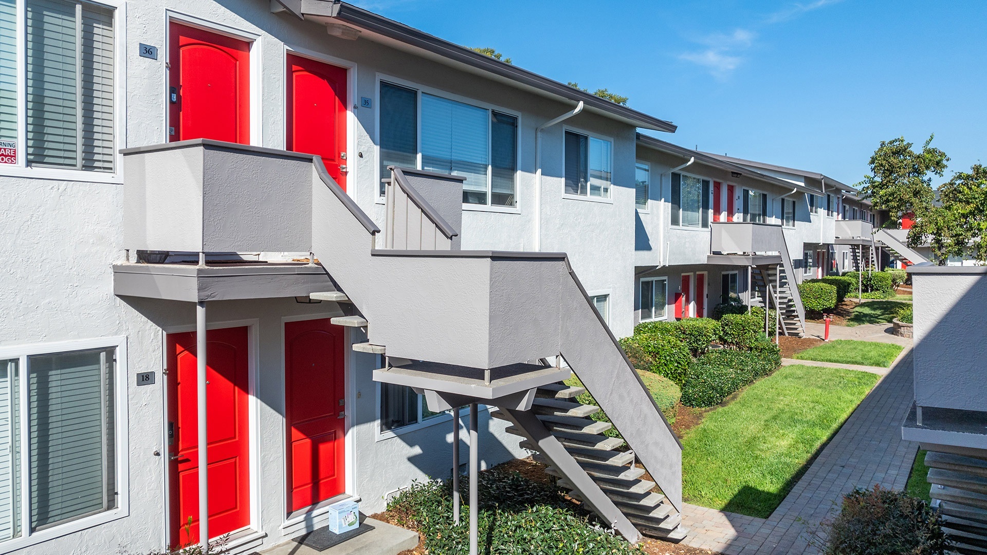 Marina plaza courtyard stairs red doors