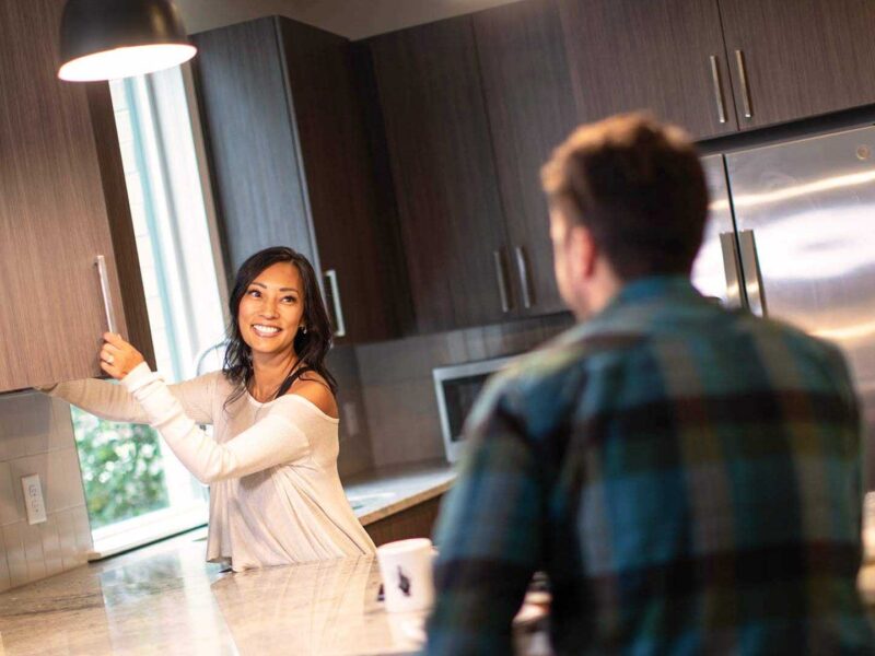 Reve lifestyle woman smiling in kitchen 2