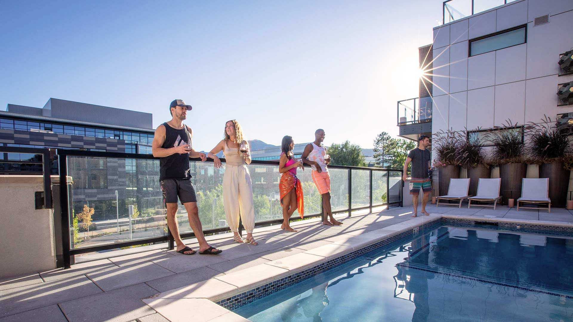 Reve lifestyle friends talking on pool deck 2