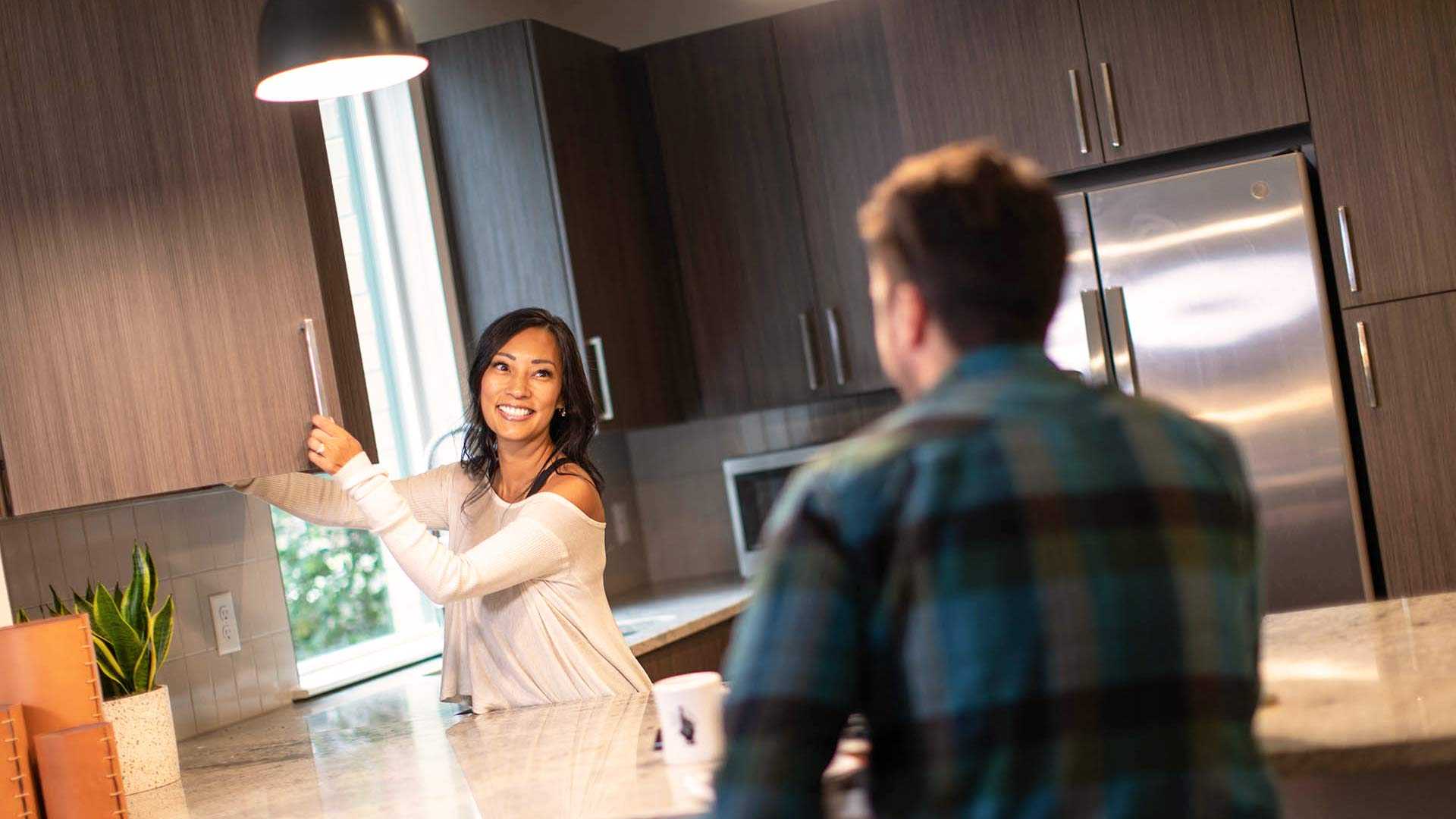 Reve lifestyle woman smiling in kitchen 2