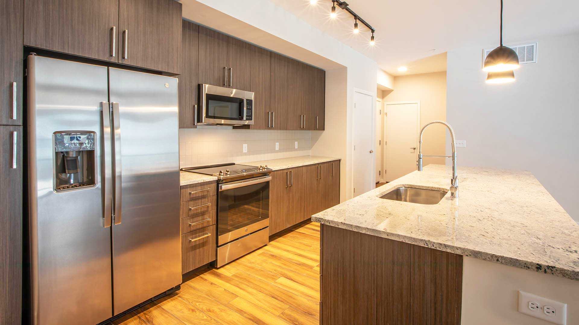 Reve apartments c1 kitchen island warm decor view