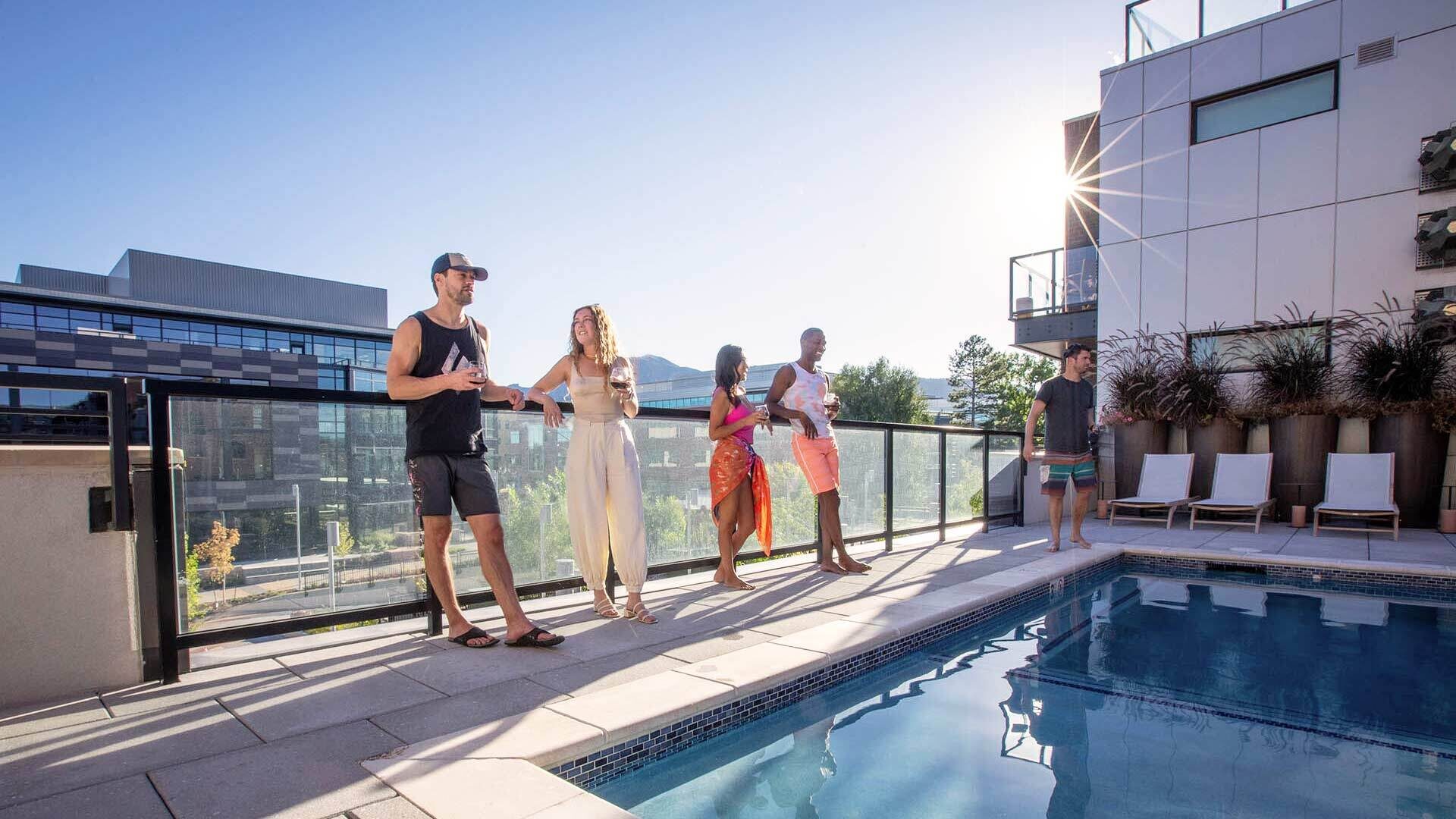 Reve lifestyle friends talking on pool deck 2