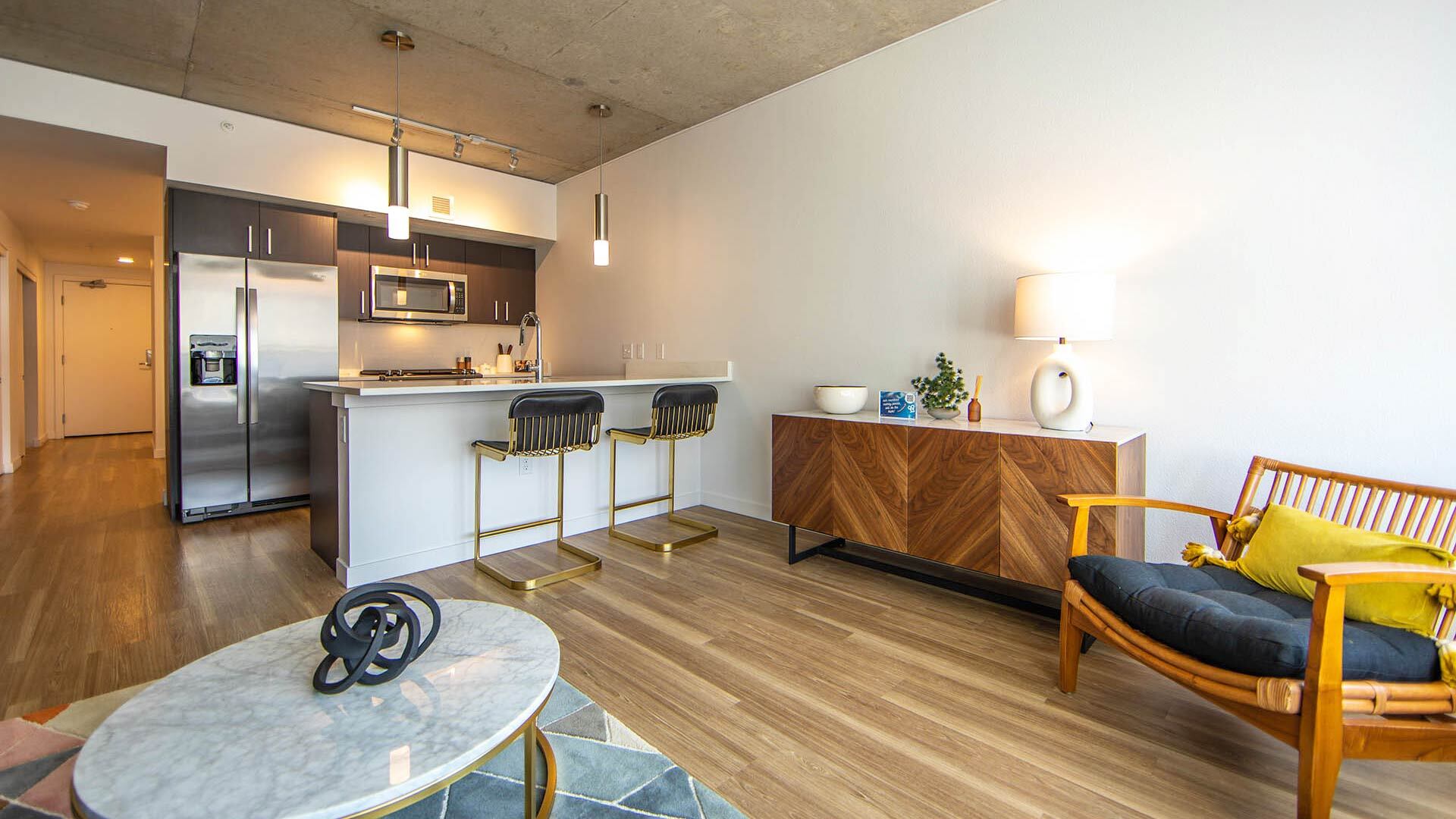 Goss B1 1br model livingroom kitchen view 2